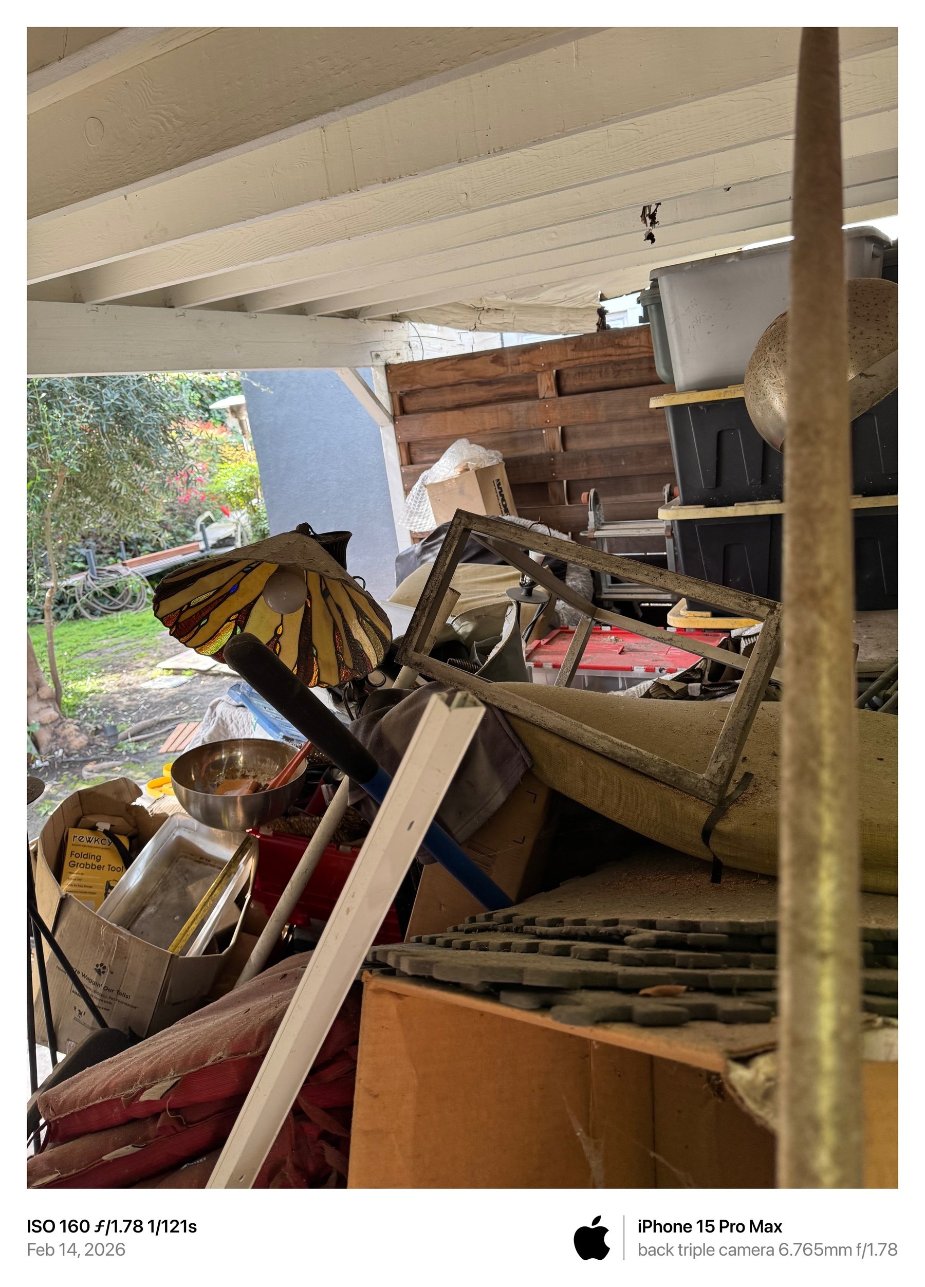 February 14, 2026 photograph showing collapsing stored materials, multiple light fixtures, bulbs, and debris
